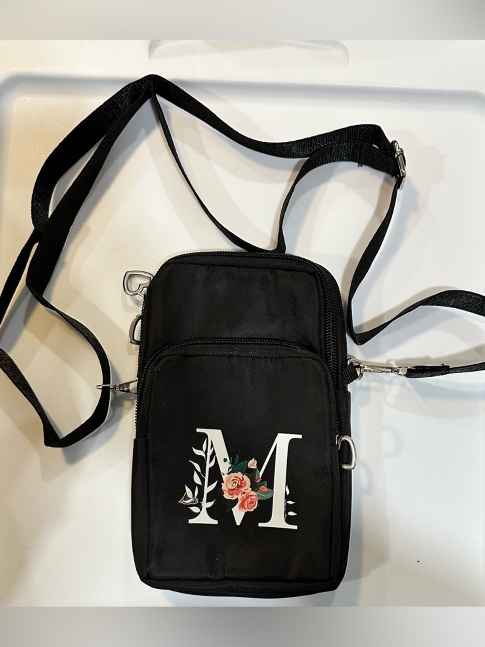 Black Crossbody Phone Bag with Floral 'M' Accent